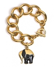 A sweet elephant charm dangles from bold gold links. By Trina Turk.