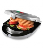 Take charge of hunger with the Big Boss grill from Emson. Griddle, grill or snap in specialty plates to cook crispy waffles, hot sandwiches, fresh donuts and omelettes in no time flat. A nonstick surface means healthier meals and effortless cleanup. One-year limited warranty. Model 8153.