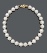 The ultimate look of elegance. This simple strand highlights A quality cultured freshwater pearls (6-7 mm) and a polished 14k gold clasp. Approximate length: 8 inches.