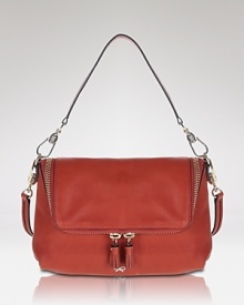 This go-anywhere crossbody style boasts a roomy interior with whimsically labeled pockets. From Anya Hindmarch.