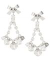 Where's the party? Don't leave home for a festive occasion without Betsey Johnson's chic chandelier earrings! Featuring a sparkling array of clear crystals accented by dainty bows, they're set in silver tone mixed metal. Approximate drop: 2 inches.