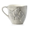 Broad-winged butterflies decorate this substantially sized, handcrafted ceramic mug. Subtle variations in color and slightly irregular rims give each piece an artfully organic warmth.