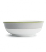 Stripes of gray and green trim this versatile serving bowl, a stylish complement to the bold graphic blooms of Floral Fan dinnerware by Echo Design.