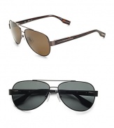 A sporty look in fit for a suit or shorts in lightweight metal with logo temple detail. Available in brown Havana frames with brown polarized lenses or matte black frames with grey polarized lenses. Logo temple detail 100% UV protective Imported 