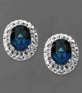 Startling baby blues. Oval-shaped blue crystals adorn Kaleidsocope's knock out stud earrings. Crafted in sterling silver with Swarovski Elements. Approximate drop length: 6/8 inch. Approximate drop width: 1/2 inch.