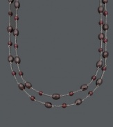 Add a subtle spark to your look with rich, red hues. This two-row necklace features 5 to 6 millimeter and 6 x 8 millimeter garnet beads (85 ct. t.w.) strung on delicate sterling silver chains. Approximate lengths: 16 and 17 inches.