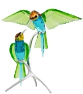 Birds of a feather. Perched on silvertone metal branches, the Swarovski Bee-eaters are a beautiful sight, intricately crafted from approximately thirty separate pieces and with wings of sparkling peridot crystal.