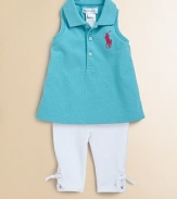 This adorable set features a classic polo and stretch leggings with lace-up ties along the ankles.Ribbed polo collarSleeveless with ribbed arm openingsFront buttonsRacerback-styleEmbroidered pony logoUneven side-vented hemElastic waistbandTop: CottonLegging: 93% cotton/7% elastaneMachine washImported Please note: Number of buttons/snaps may vary depending on size ordered 