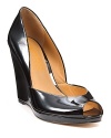 Patent leather peeptoe wedges from KORS Micheal Kors, oh so high yet oh so comfortable. A versatile shoe that goes from day to night with ease.