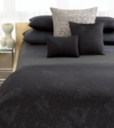 Inspired by a Calvin Klein fashion collection, the Gardenia sham features an intricate pattern of flowers and vines woven in tones of ebony and ash on a rich black background. Reverses to self. French back closure.