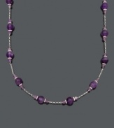 Perfect your look with a pop of regal color. Necklace features 60 carats of amethyst beads (4-5 mm and 9-10 mm) set in sterling silver with a tin-cup design. Approximate length: 18 inches.