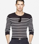 Tailored in a trim-fitting silhouette, a striped long-sleeved crewneck tee embodies effortless style in fine-ribbed, mercerized cotton.