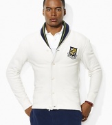 A handsome shawl collar and preppy embroidered crest lend authentic collegiate style to a supremely soft fleece cardigan.