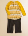 A cheery two-piece ensemble for your little guy, featuring a striped baseball-inspired shirt paired with soft pants. Ribbed crewneckLong sleevesButton frontContrast stitching at hemElastic waistbandFront pocketsBody: polyester/rayonTrim: modal/cottonMachine washImported