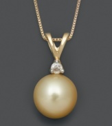 A golden spin on a traditional pearl necklace. This perfect pendant features an exotic golden south sea pearl (8-9 mm) with a sparkling diamond accent. Necklace crafted in 14k gold. Approximate length: 18 inches. Approximate drop: 5/8 inch.