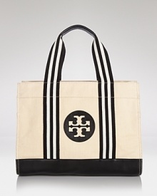 Uptown girls will love Tory Burch's update of it's signature tote. In twill with bold logo detailing, it encapsulates casual chic.