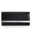 Simple, soft, and completely essential, this luxe leather wallet from MICHAEL Michael Kors stylishly stows all your everyday must-haves. The perfectly aligned interior provides plenty of pockets and compartments, while the exterior is accented with sleek silvertone detailing.