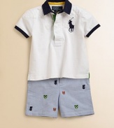 A preppy short sleeved rugby and oxford shorts with allover athletic embroidery are paired to make the perfect preppy set. Shirt Contrast twill collarShort sleeves with contrast trim at the hemFront buttonDiamond-quilted front and back yokeDouble back vents Shorts Front button closureZip flyBelted waistband with elastic back and matching double D-ring beltSide on-seam pocketsButton-through back welt pocketCottonMachine washImported