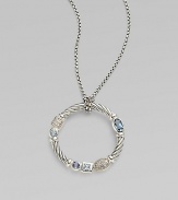 From the Confetti Collection. A wreath-shaped cable pendant, luxuriously set with pavé diamonds and other gemstones, dangles from a sterling silver chain. Diamonds, 0.05 tcw Blue topaz and iolite Sterling silver Chain length, about 16 Pendant diameter, about 1 Lobster clasp Made in USA