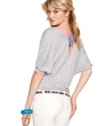 Eyeshadow adds pop to a slouchy-cool top by way of bright, crisscrossed back straps!