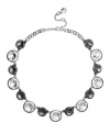 Add polished perfection to your look in Monet's chic statement necklace. Polished discs crafted from silver and hematite tone mixed metal add instant shimmer. Approximate length: 16 inches + 2-inch extender.