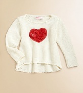 A cute, cozy knit gets a lovely update with a bold heart appliqué.Round necklineLong sleevesPullover styleHi-lo hemRayon/CottonHand washImported