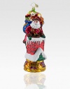 Inspired by the famous Christmas song, a fancily decorated Santa carefully makes his way down the chimney with a bag full of toys. Hand-blownHand-painted7½ highMade in Poland