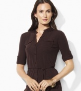 Rendered in flattering matte jersey for a gentle drape, Lauren by Ralph Lauren's shirt is tailored with three-quarter roll-tab sleeves for a versatile finish.