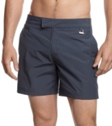 Keep it classic even in the sand. Get sunny style and comfort with these bermuda swim trunks from Calvin Klein.