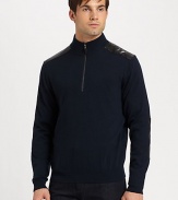 Leather detailing at the collar and elbows lends an incredibly modern aesthetic to a classic pullover design.Half-zip frontRibbed knit collar, cuffs and hemWoolDry cleanImported