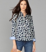 Go geometric in this striking shirt from Tommy Hilfiger. Goldtone buttons and solid foldover cuffs lend the right preppy touch to this versatile top. (Clearance)