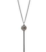 A minimal design can have maximum impact, as illustrated by Kenneth Cole New York's long, linear lariat necklace. Crafted in hematite tone mixed metal with a fireball and tassel charm. Approximate length: 30 inches + 3-inch extender. Approximate drop: 1 inch.