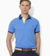 Bold color-blocking enlivens a classic polo crafted from lightweight cotton mesh for the perfect blend of comfort and eye-catching style.