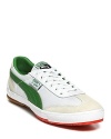 Other kicks will envy these streamlined PUMA sneakers, featuring lush green suede stripes and color-pop neon soles.