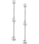 Elongated grace. Cultured freshwater pearls (4-8 mm) are arranged across a sterling silver chain to create a sophisticated set of long drop earrings. Approximate drop: 2 inches.