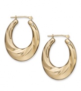 Gold. Glam. Gorgeous. Every girl needs a pair of hoop earrings, and Signature Gold's™ diamond-accented pair couldn't be more perfect. Crafted in 14k gold with a chic oval shape and draped design. Approximate drop length: 1-1/8 inches. Approximate drop width: 3/4 inch.