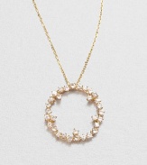 Sparkling white sapphires set in 14k gold with a open circle design on a delicate link chain. White sapphire14k goldLength, about 16Pendant size, about .6 Spring ring closureMade in USA