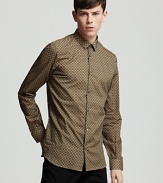 Crisp cotton showcases a classic button front shirt from Burberry London.