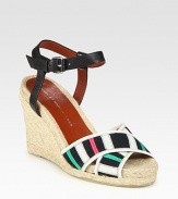 Multicolored grosgrain ribbon straps grounded by a classic espadrille wedge, finished with an adjustable leather ankle strap. Hemp wedge, 4 (100mm)Hemp platform, 1 (25mm)Compares to a 3 heel (75mm)Leather and grosgrain ribbon upperLeather lining and solePadded insoleImportedOUR FIT MODEL RECOMMENDS ordering one half size up as this style runs small. 