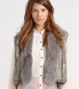 Layer up in an undeniably posh rabbit fur vest with a coyote fur shawl collar. Dyed coyote fur shawl collarSleevelessAbout 20 from shoulder to hemBody: Dyed rabbit fur; Contrast: Dyed coyote furDry clean with fur specialistMade in USARabbit fur origin: ChinaCoyote fur origin: USAModel shown is 5'10 (177cm) wearing US size Small.