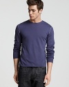 A super light - almost sheer - crewneck shirt in soft merino wool with contrast stitch details at the shoulder and elbows.