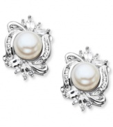 Charming and sophisticated. These elegant stud earrings combine cultured freshwater pearls (7 mm) and sparkling white topaz (1-1/6 ct. t.w.) in sterling silver. Approximate diameter: 11/16 inch.