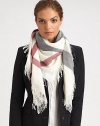 A vibrant check design is printed on this plush wool scarf with allover fringe trim.Wool43 X 43Dry cleanImported