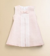 Airy and lovely linen is adorned with a pretty bow and embellished with front lace detail.Jewel necklineSleeveless with scalloped detailingBack buttonsA-line silhouette56% linen/44% cottonMachine wash coldImported Please note: Number of buttons may vary depending on size ordered. 