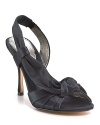 A satin strap wraps behind the heel and forms an elegant knot at the open toe of these shining evening sandals.