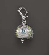 Inspired by Zen philosophy, this polished sterling silver Raja meditation bell from Paul Morelli is set with blue topaz and peridot.