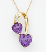 Satisfy your craving for vibrant color with this sparkling pendant! Two graduated heart-shaped amethysts 2-5/8 ct. t.w.) are prong-set in 14k gold. Diamond accents add elegance.