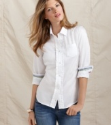 The classic white button-front shirt gets girly with ruffled trim in this Tommy Hilfiger look. Pair it with boyfriend jeans for high contrast and chic style.