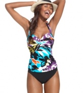 Miraclesuit's tankini top gets the tropical treatment with a bold floral print. Extra tummy control and well-placed ruching give you the sleek look you love!