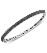 Slim, stackable style. Kaleidoscope's thin shimmering bangle makes a statement all its own, but can also be stacked with similar styles for a trendy layered look. Features round-cut black crystals with with Swarovski Elements. Set in sterling silver. Bracelet features a hinge clasp. Approximate diameter: 2-1/2 inches.